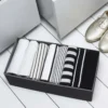Organisateur de tiroir en carton gris et noir. Taille L