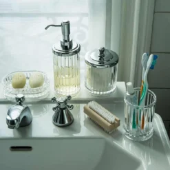 Pot à coton cannelé en plastique transparent avec un couvercle en métal